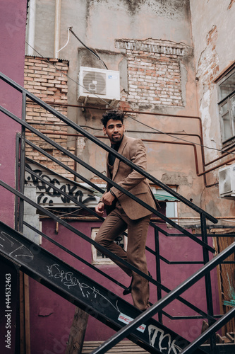 business suit on a dark-skinned man, tuxedo, three-piece suit