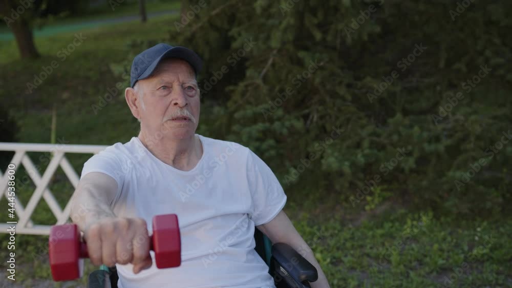 Its a challenge for older man to do exercises with dumb-bells Its a challenge for older man to do exercises with dumb-bells