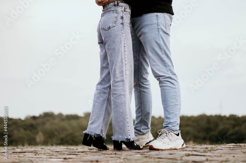 Young couple kissing outdor. Couple kissing outdor.. Male and female legs during a date