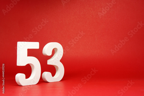 Fifty Three ( 53 ) white number wooden Isolated Red Background with Copy Space - New promotion 53% Percentage Business finance Birthday Celebration Concept 