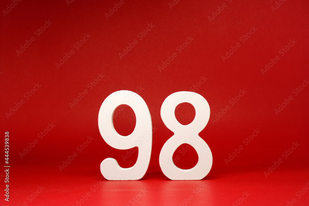 Ninety Eight ( 98 ) white number wooden on Red Background with Copy Space - New promotion 98% Percentage , Birthday anniversary , Business finance Concept Ninety Eight ( 98 ) white number wooden on Red Background with Copy Space - New promotion 98% Percentage , Birthday anniversary , Business finance Concept