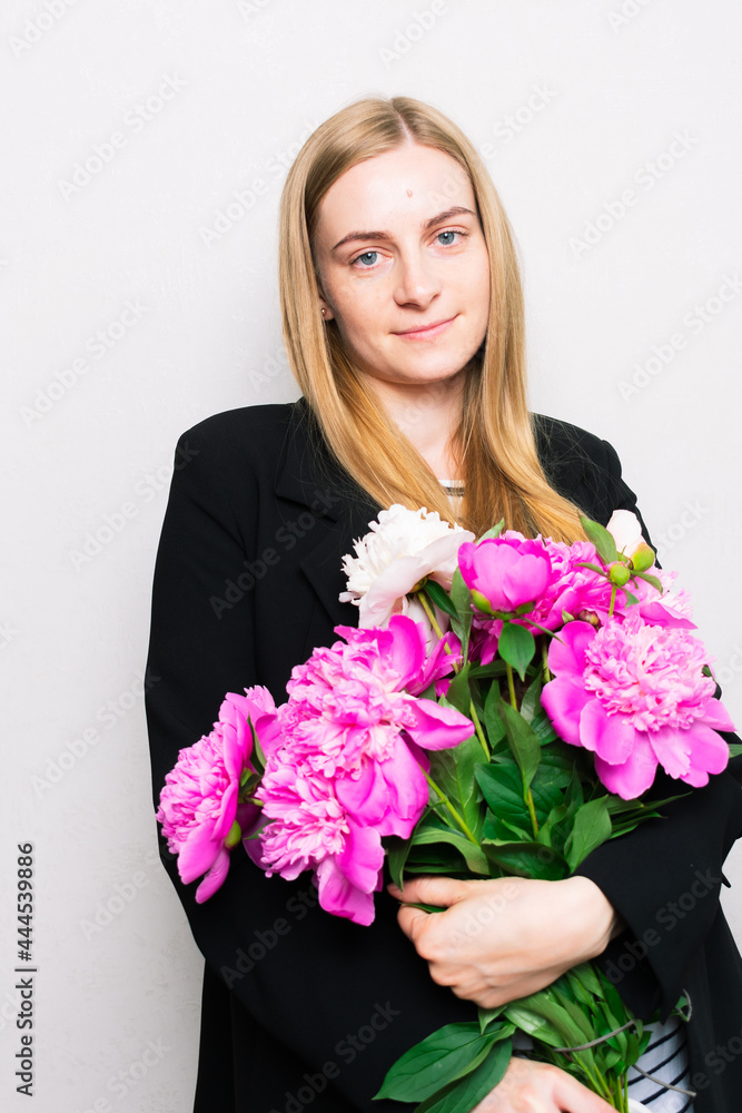 Beautiful lady holding a bouquet of fresh flowers Beautiful lady holding a bouquet of fresh flowers