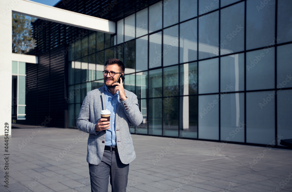 Fototapeta premium Busy businessman talking on phone