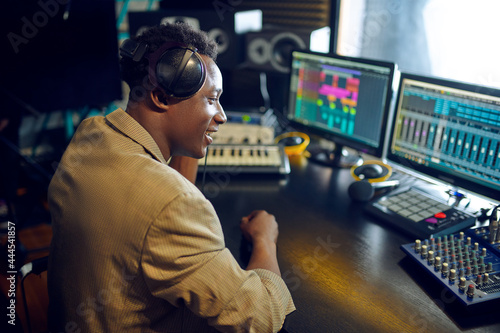 Male dj working on a new hit, recording studio