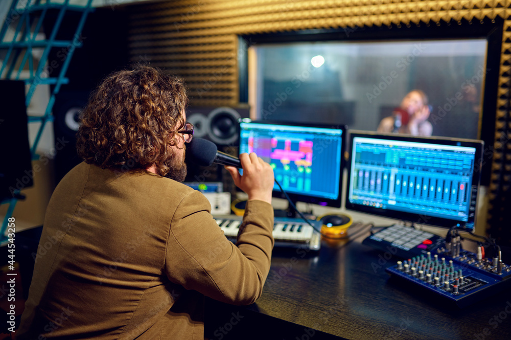 Musician and female performer, recording studio Musician and female performer, recording studio