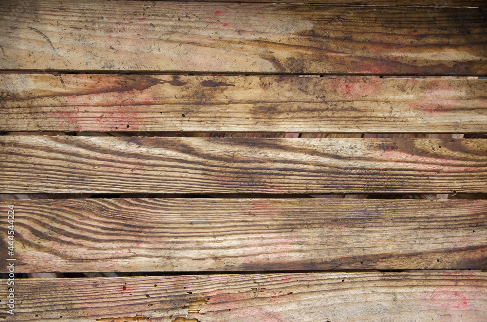 Fototapeta premium Background of horizontal wooden boards. Texture of box planks. Wood is susceptible to damage by the bark beetle.