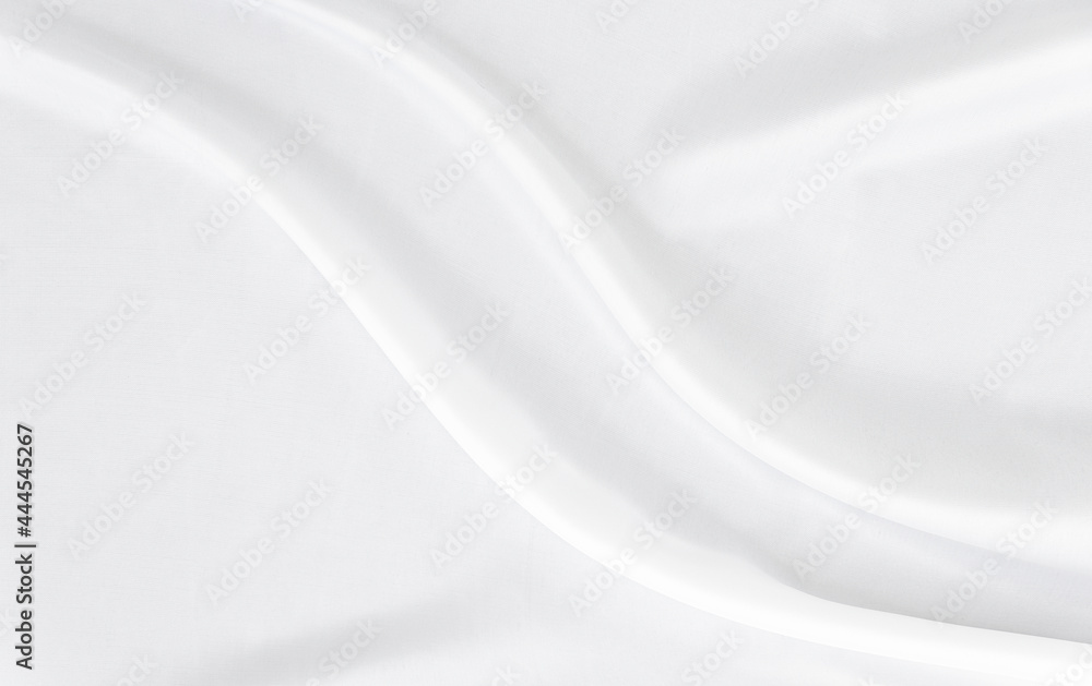 White gray satin texture that is white silver fabric silk background with beautiful soft blur pattern natural.