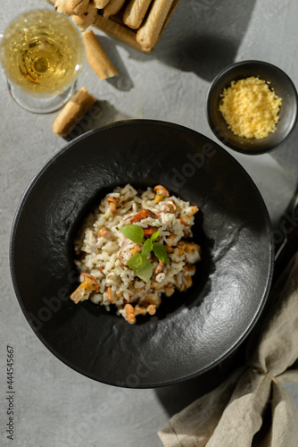 chanterelle risotto in a black plate