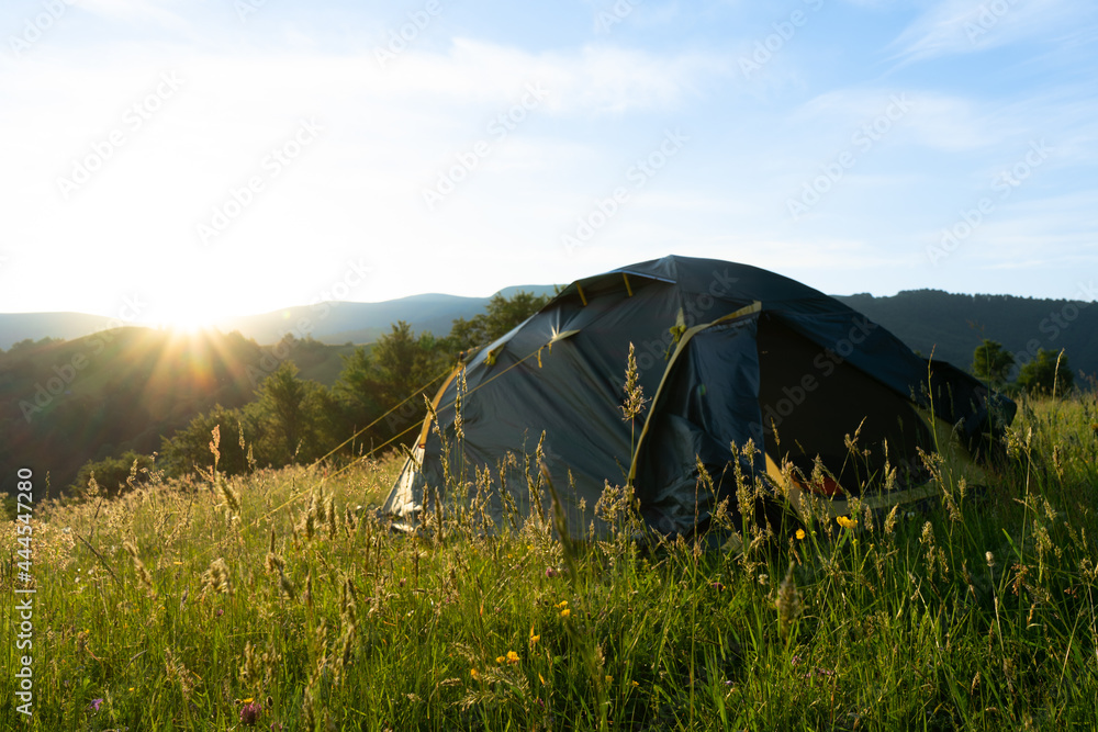 Camping at sunrise on Apetska mountain, Carpathians in Dubove, Ukraine on June 22, 2021.