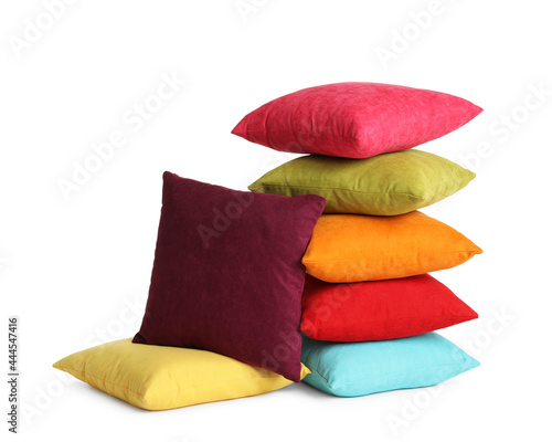 Different colorful decorative pillows on white background