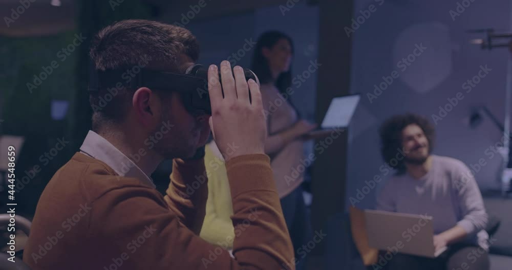 Disabled businessman in a wheelchair at work in modern open space coworking office on team meeting using virtual reality goggles and drone simulation Disabled businessman in a wheelchair at work in modern open space coworking office on team meeting using virtual reality goggles and drone simulation