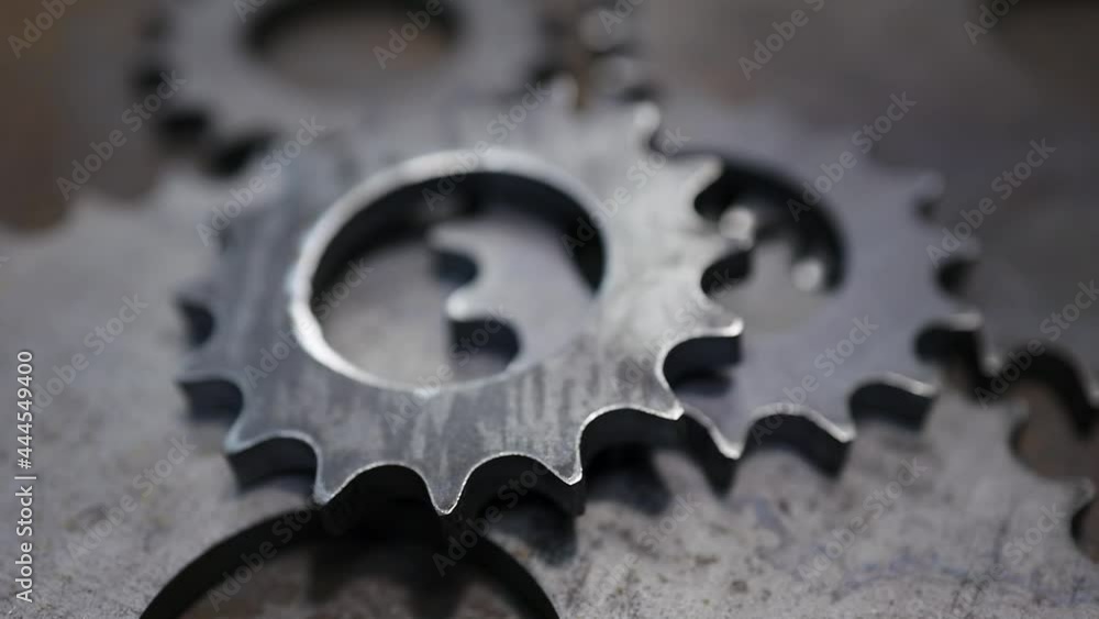 small and large round and flat gears are next to each other. mechanisms for interaction small and large round and flat gears are next to each other. mechanisms for interaction