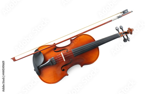 Beautiful violin with bow on white background, top view. Classic musical instrument photo