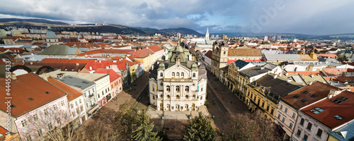 Wide Panorama of Kosice city main street and Historical buildings with sunlight and rain in the back; photo was taken from the tower of church St. Elisabeth Cathedral, Kosice, Slovakia