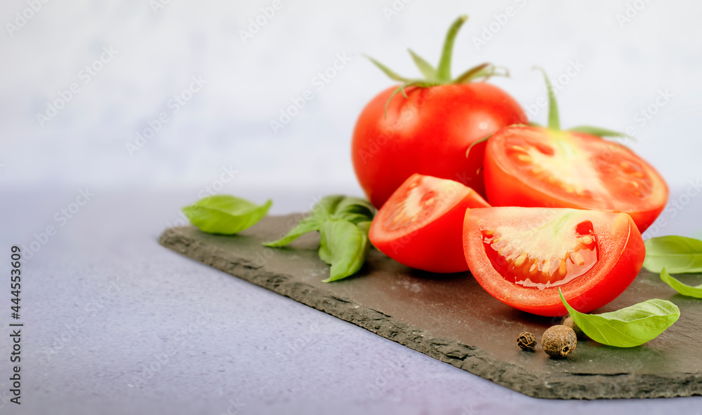 chopped tomato and basil leaves on the table chopped tomato and basil leaves on the table