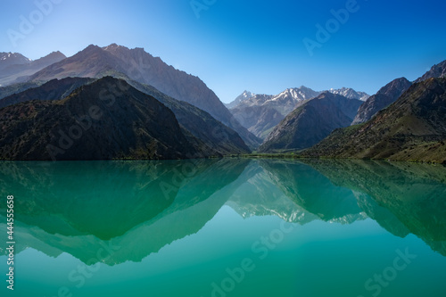 Reflection of turquoise Lake Iskanderkul (Iskander Kul) Fann mountains, Tajikistan, Central Asia