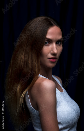 Portrait of a beautiful woman with a long brunette hair. brown-haired caucasian girl. Copycpase 