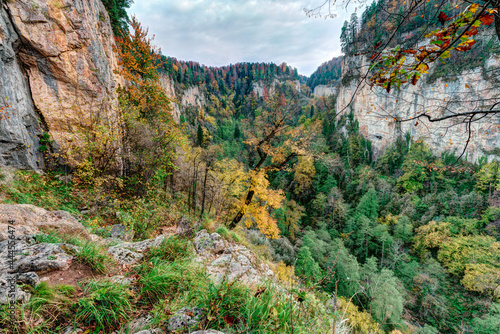 Beautiful scenic autumn landscape of fairy Caucasus forest by Mezmay village, Kurdzhips river gorge, Caucasus mountains, Russia. photo