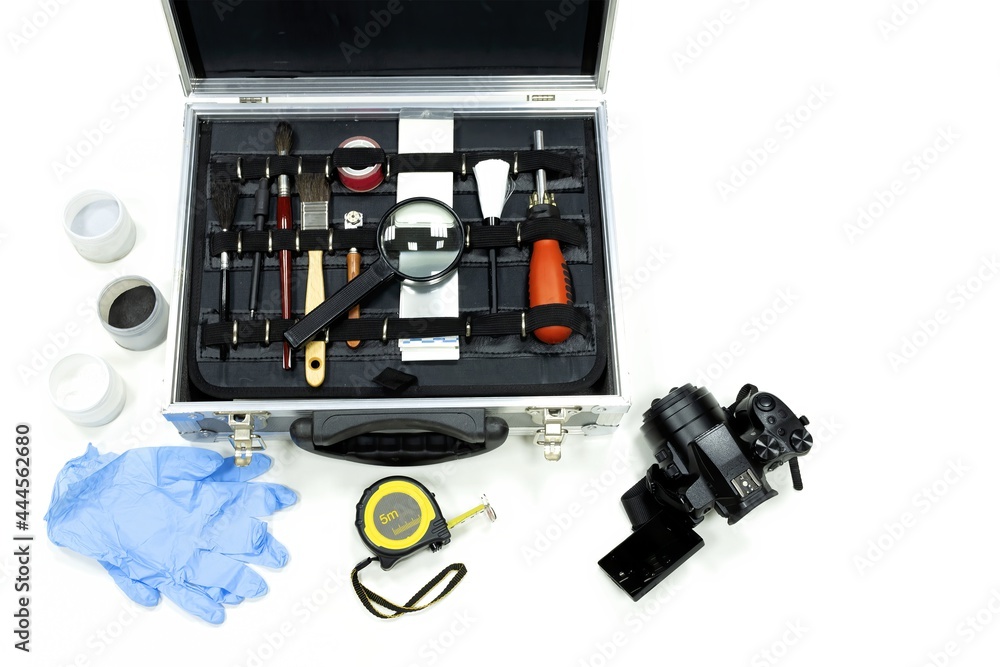 Top view of a scientific police briefcase, CSI with everything needed for a criminal investigation Top view of a scientific police briefcase, CSI with everything needed for a criminal investigation