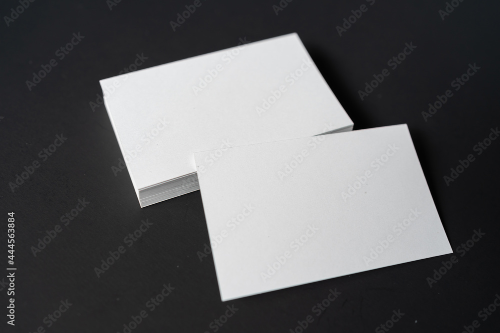 Pile of white blank space business name cards stack template for advertise and marketing on wooden texture background, clipping path for insert your banner text design for present the company brand Pile of white blank space business name cards stack template for advertise and marketing on wooden texture background, clipping path for insert your banner text design for present the company brand