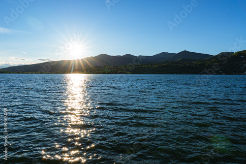 Spring sunset on the shores of Lake Pusiano, near the town of Bosisio Parini, Italy - May 2021. photo