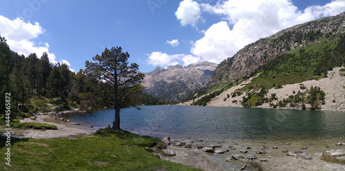 Landscape in the National Park of Aigüestortes and Lake San Mauricio. View of the Lake Llong and glacier lateral moraine. Pyrenees Mountains. Catalonia. Spain.