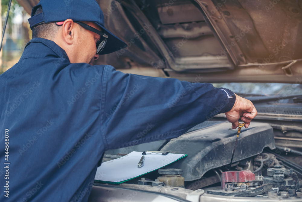 Mechanic car service auto garage in automotive mobile center. Technician workshop repair engine motor vehicles service mechanical engineering business. Automobile mechanic hands car repairs technic