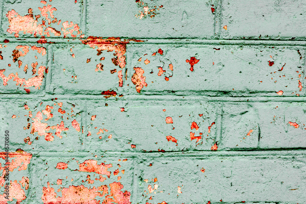 Texture of a brick wall with cracks and scratches which can be used as a background Texture of a brick wall with cracks and scratches which can be used as a background