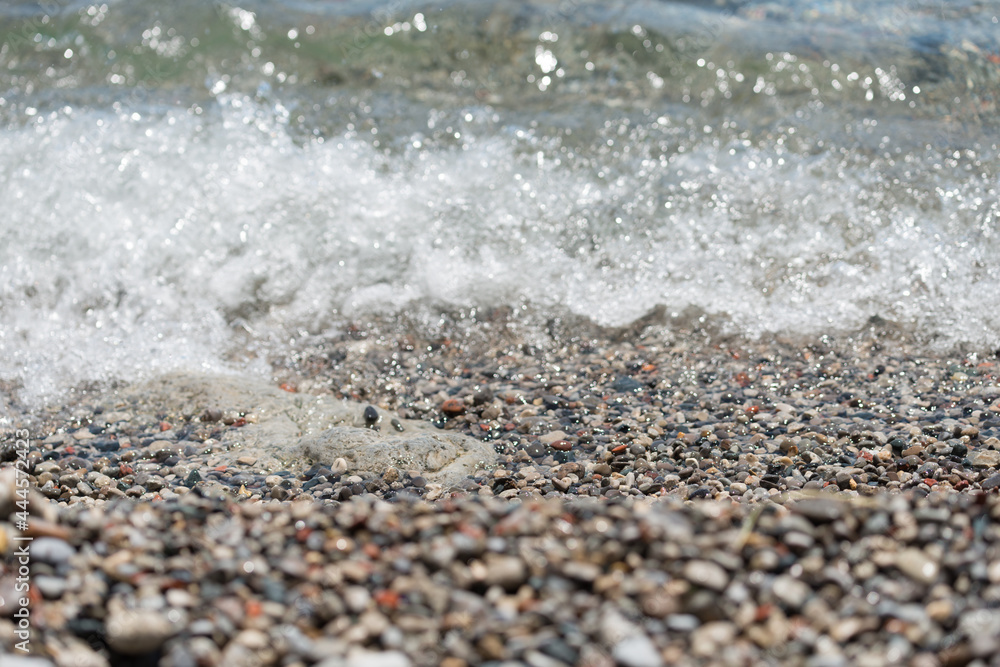 pebble beach and waves - sunny weather pebble beach and waves - sunny weather