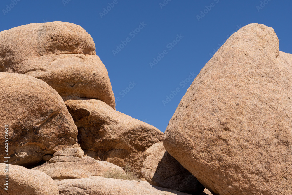 Rocks of Joshua Tree National Park Outline an extremely blue sky Rocks of Joshua Tree National Park Outline an extremely blue sky