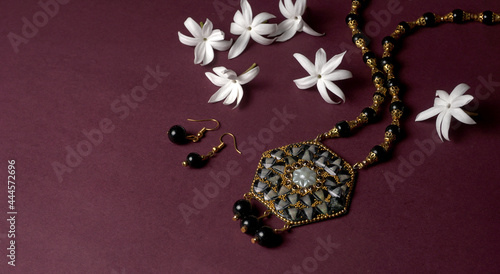 Fototapeta Naklejka Na Ścianę i Meble -  Indian traditional antique or retro style pendant on black background.
