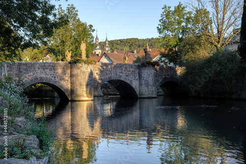 Wallpaper Mural View to the old Grünbach bridge in Gerlachsheim with baroque monastery church in the background. Torontodigital.ca