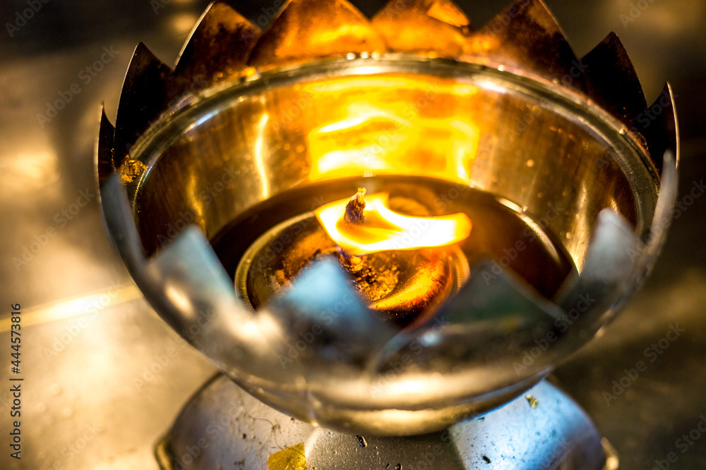 Blurred abstract background of flames lit in incense burners, for people to come to make merit or to light up the night. Blurred abstract background of flames lit in incense burners, for people to come to make merit or to light up the night.