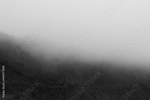 Close up of Fog splitting a mountainside in half in Pacifica California