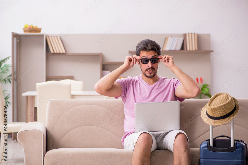 Young man preparing for trip at home Young man preparing for trip at home