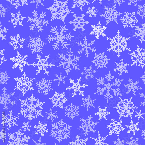Christmas seamless pattern with complex big and small snowflakes, white on blue background