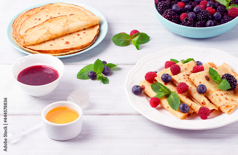 Crepes with berries, breakfast, selective focus, on a white wooden table, horizontal, no people, Crepes with berries, breakfast, selective focus, on a white wooden table, horizontal, no people,