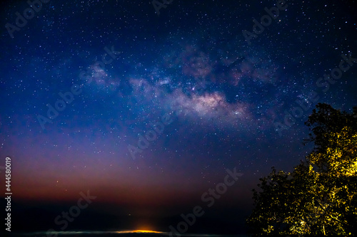 Milky Way Galaxy and fog over Kong city ,Chiang mai, Thailand