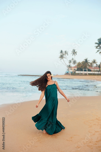 Happy woman on the beach. Сlose-up portrait of the beautiful girl. Young pretty girl. Young smiling woman outdoors portrait.