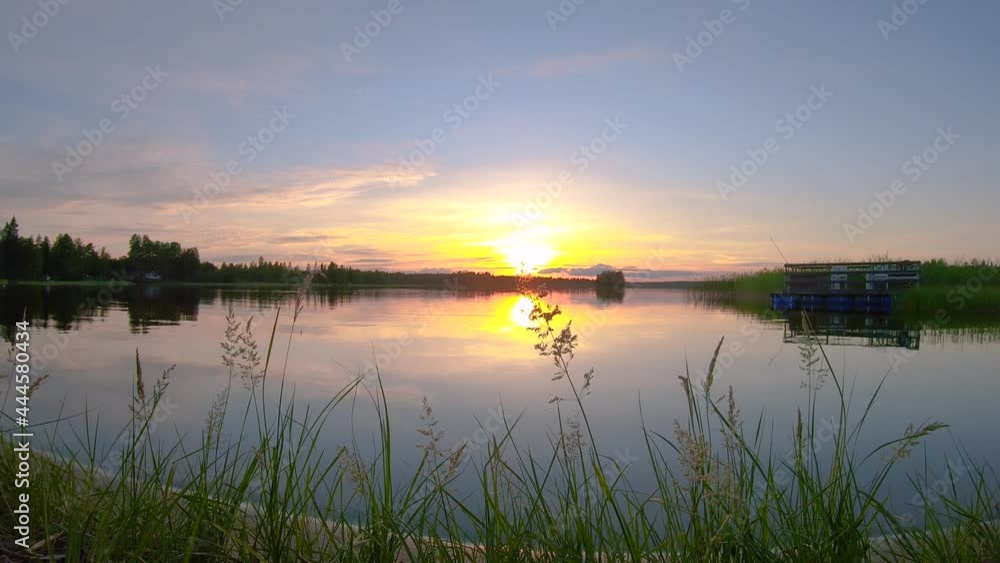 The timelapse of spectacular landscape and very colorful sunset over the calm lake. Beautiful panoramic sunset reflection from lake water. 4k Push through slowmotion video. The timelapse of spectacular landscape and very colorful sunset over the calm lake. Beautiful panoramic sunset reflection from lake water. 4k Push through slowmotion video.