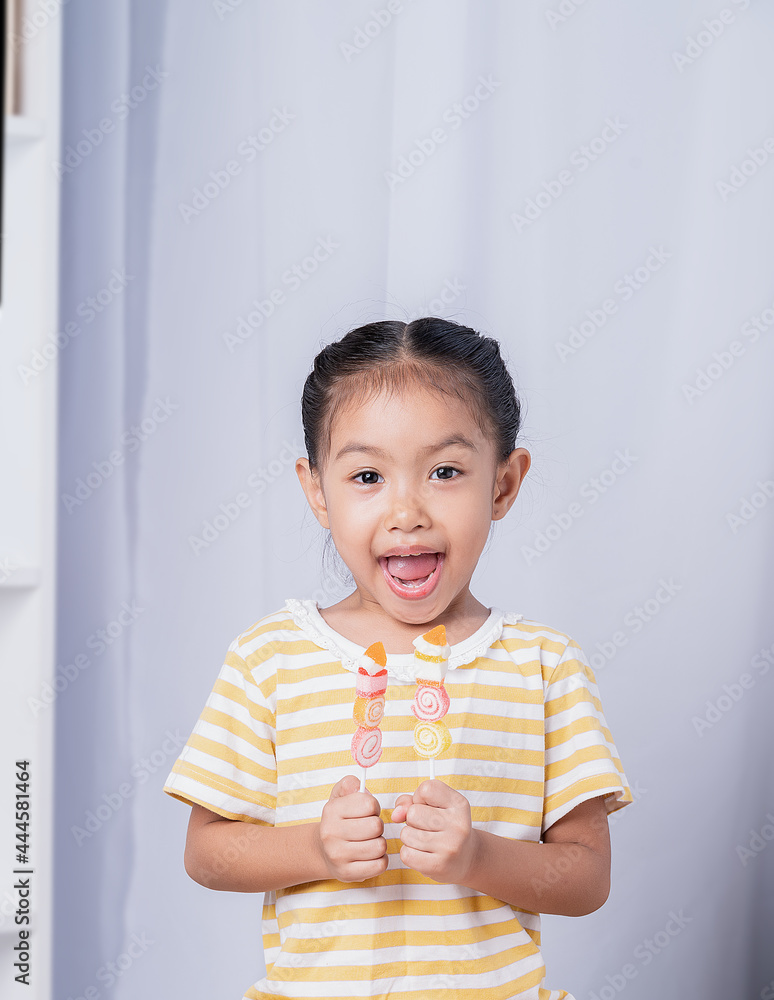 A girl is happy to eating sweet dessert.