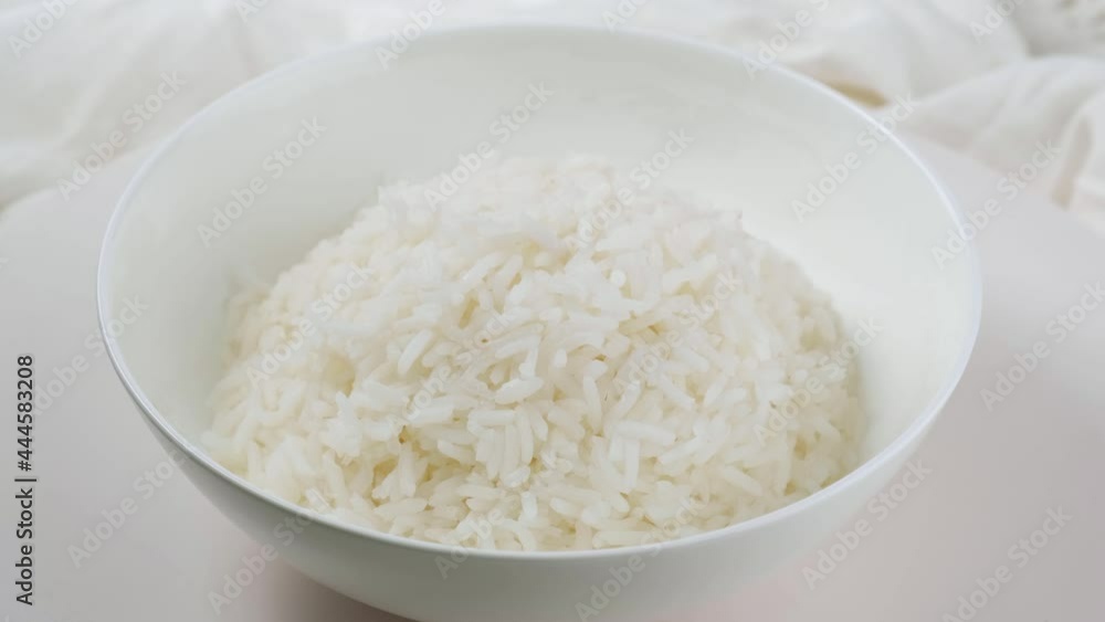 Cooked rice in white plate on white background. Cooked rice in white plate on white background.