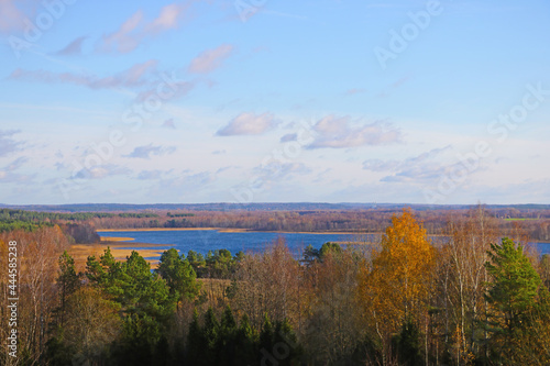 View from the height of the lake and forest in autumn.