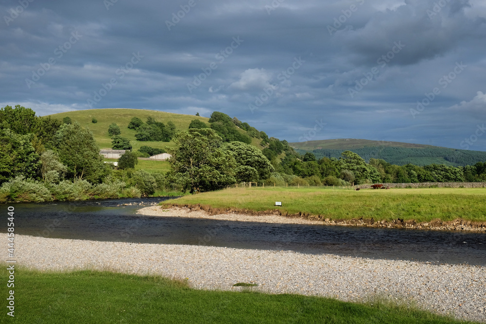 A view along the River Wharfe towards Kail Hill, in the Yorkshire Dales, North Yorkshire. A view along the River Wharfe towards Kail Hill, in the Yorkshire Dales, North Yorkshire.