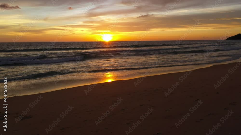 drone shooting stunning sunset at the sea in twilight.. video 4K. Nature video High quality footage. .Scene of colorful red light trough in the sky background. drone shooting stunning sunset at the sea in twilight.. video 4K. Nature video High quality footage. .Scene of colorful red light trough in the sky background.