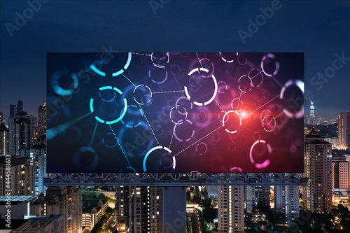 Information flow hologram on road billboard, night panorama city view of Kuala Lumpur. KL is the largest technological center in Malaysia, Asia. The concept of programming science.