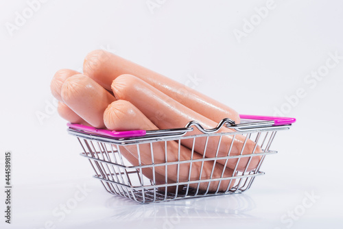 Sausage on a white isolated background. Sausage on a wooden board. 