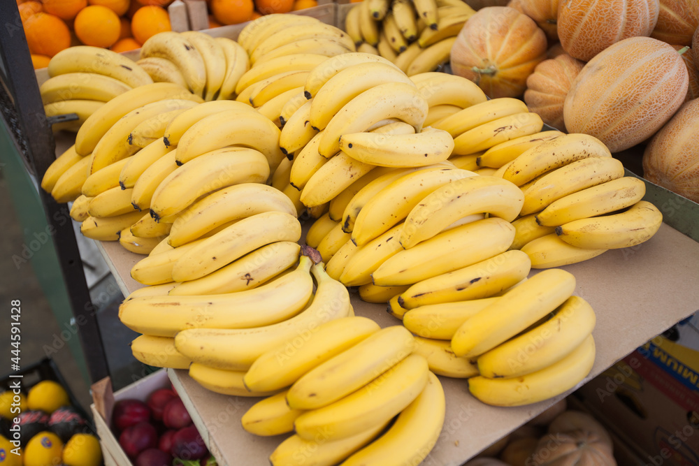 Ripe bananas on outdoor market . Tropical fruit on street market