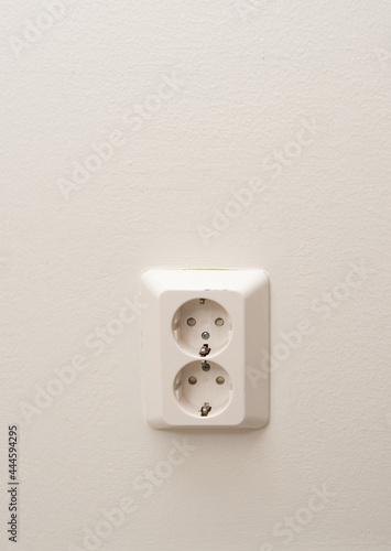 An electrical outlet on a wall.