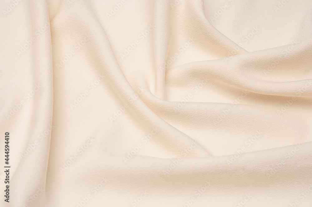 Smooth elegant ivory tissue abstract background. Textile background. Cloth wallpaper. Graphics design element